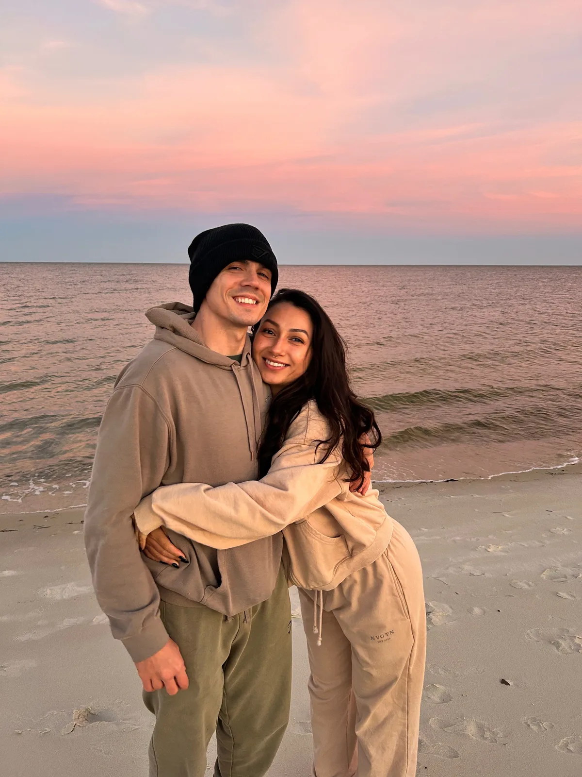 Quade and Alisa, founders of Nova Terra Digital, together at sunset